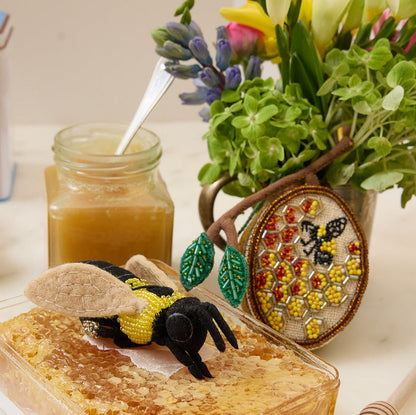 Golden beehive ornament symbolizing sweetness, abundance, and new beginnings