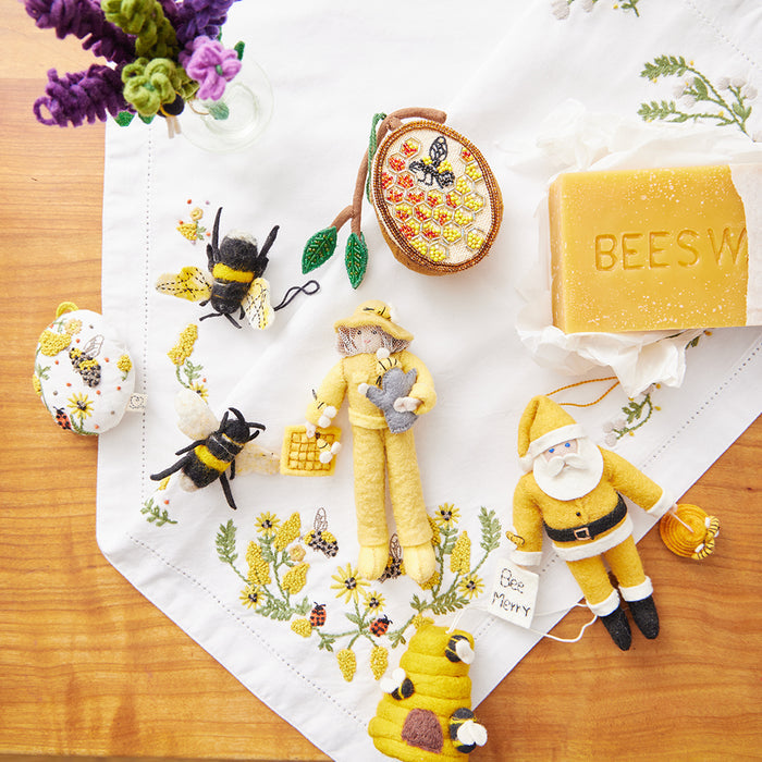 Handmade beehive ornament honoring pollinators, ideal for spring celebrations