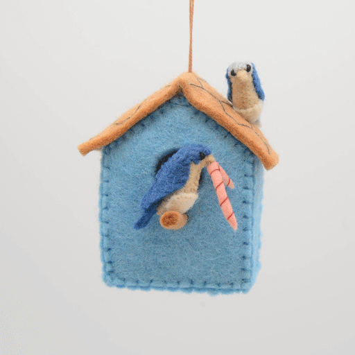Wool birdhouse ornament made from merino-blend felt, celebrating backyard birds and the quiet joy of spring, ideal for nursery décor or nature-themed displays