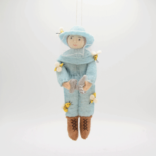 Eco-friendly wool ornament of female beekeeper in soft blue suit, handmade in Kyrgyzstan