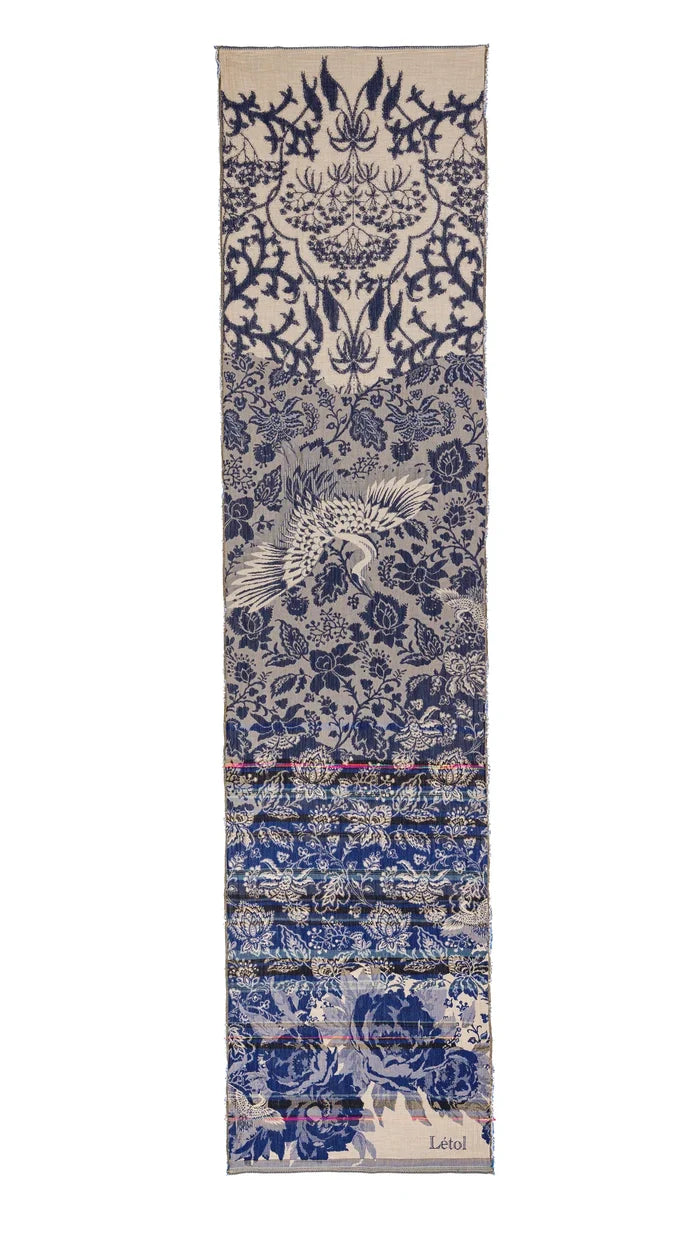 Létol Bridget Scarf in Marine, laid flat and fully extended against a white background, showing the full length of the scarf — the top half displaying an intricate navy botanical tree-of-life and vine pattern on an off-white ground, transitioning through a central zone featuring a large Jacquard-woven crane in flight among navy peonies and lotus on a light grey ground, into a lower half of dense indigo and navy floral tapestry with peony and chrysanthemum motifs, with the woven Létol signature at the base