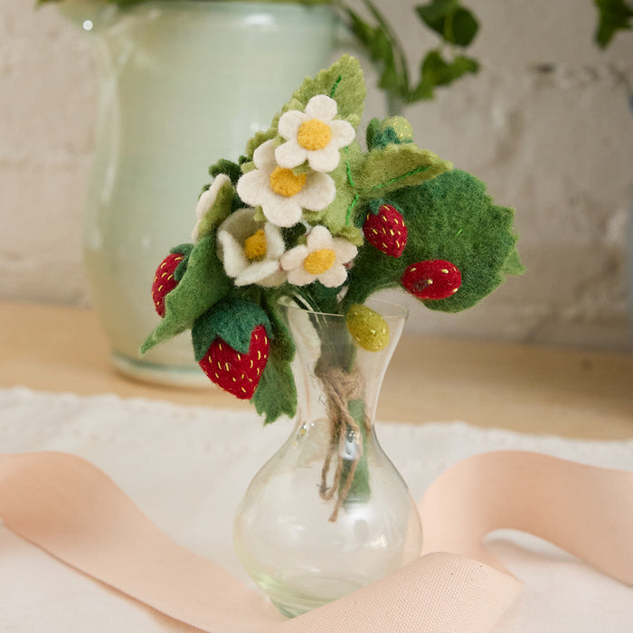 Hand-felted strawberry bouquet with white blossoms and greenery in recycled glass vase, handmade decor.