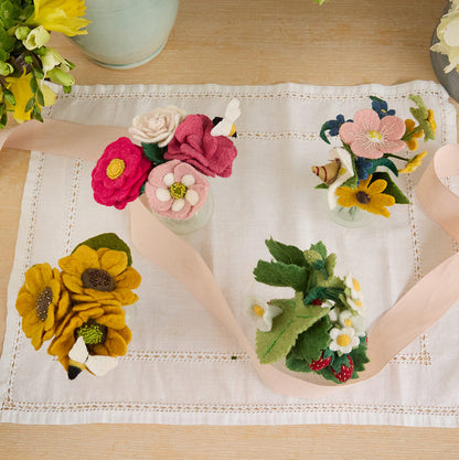 Eco-conscious felt strawberry bouquet in recycled glass vase, ideal for kitchen or bedside decor.