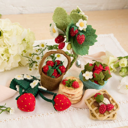 Artisan-made felt bouquet with strawberries and white blossoms, ethical handmade gift idea.
