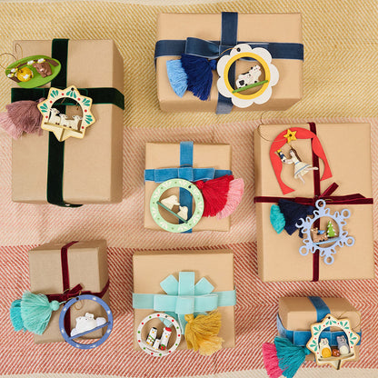 Handcrafted ornament made from wood and locally sourced clay with attached hanging string