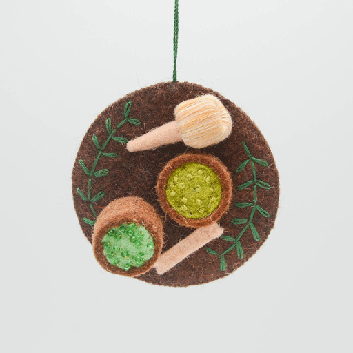 Felt Matcha Tea Set ornament with chasen whisk, tea bowl, and embroidered matcha foam, handmade from wool and ready to hang. Ideal gift for tea lovers. GIF