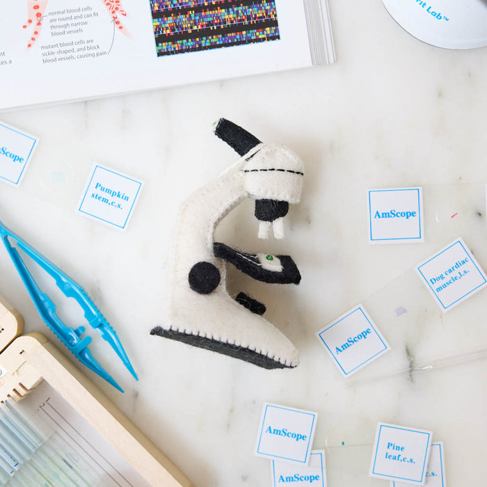 Celebrate curiosity, discovery, and the wonders of science with our handmade Felt Microscope Ornament — a charming keepsake perfect for scientists, biology lovers, teachers, researchers, lab technicians, and STEM enthusiasts.