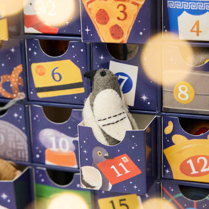Advent Detail - Countdown to Holiday Magic in iconic style, with our handmade New York City Advent calendar featuring 24 miniature felt ornaments inspired by the landmarks, foods, neighborhoods, and wonderfully quirky icons of NYC.