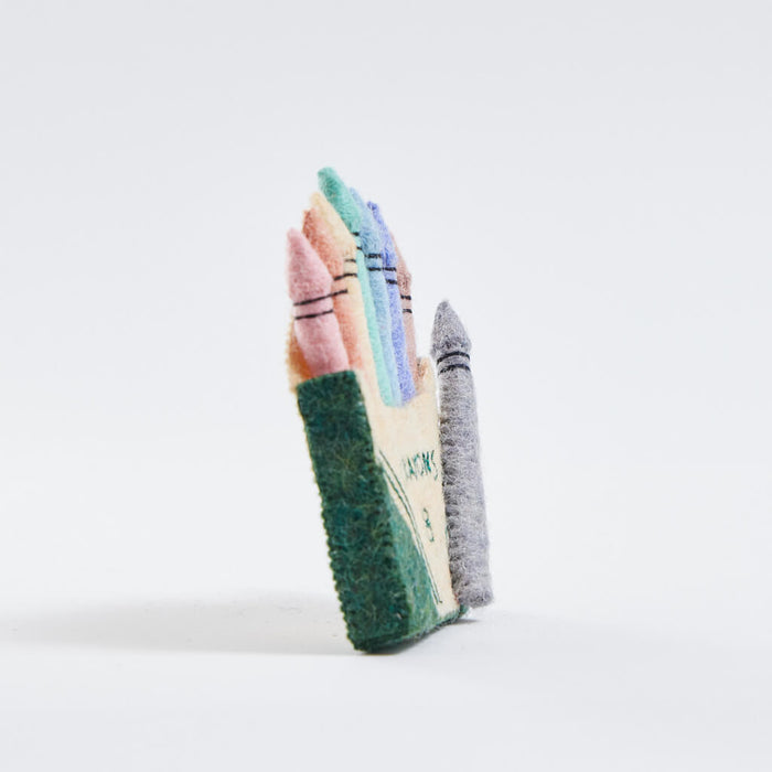 Felt pastel crayon box ornament with stitched details, handmade and fair trade.