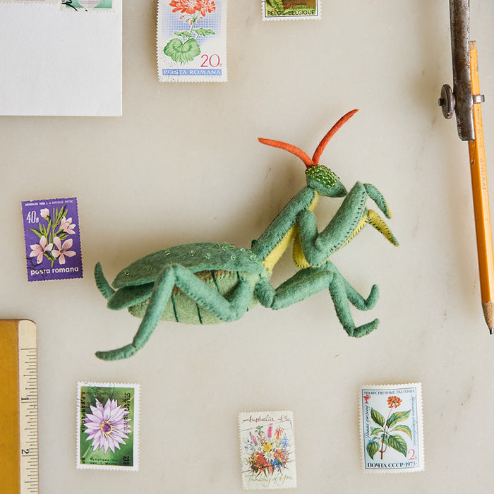 Graceful Praying Mantis ornament crafted from felted wool with sculpted limbs, shimmering beaded eyes, and prayerful forelegs—symbolizing balance in nature