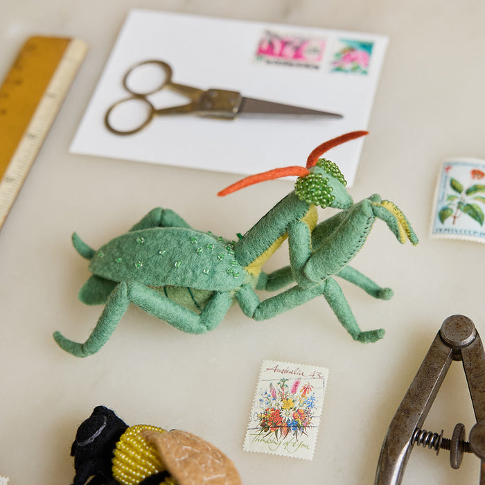 Handmade Praying Mantis ornament with intricate stitching and merino-blended wool, celebrating the beauty and intelligence of one of the garden’s fiercest protectors
