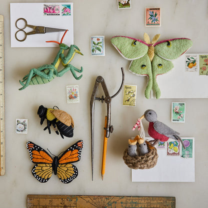 Felt wool Praying Mantis ornament with natural tones, bead accents, and delicate craftsmanship—an eco-conscious tribute to insect biodiversity