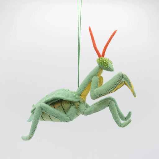 Fair trade Praying Mantis ornament with lifelike posture, locally sourced materials, and a string for easy hanging—part of a collectible nature-themed set.  GIF