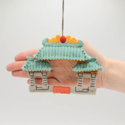 Felt Chinatown Gate ornament with embroidered dragons and jade roof, handmade by Kyrgyz artisans. Perfect Lunar New Year décor honoring Chinese tradition.