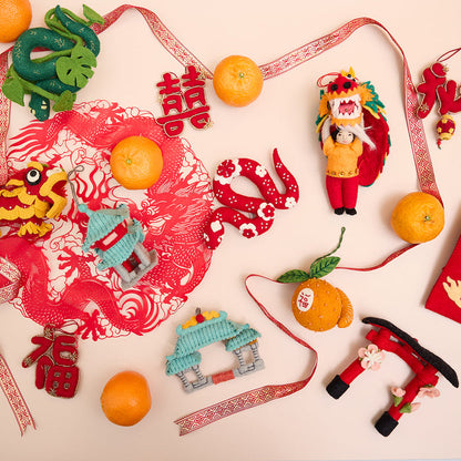 Beautiful felt Chinatown Gate ornament with embroidered dragons and jade roof – a meaningful Lunar New Year gift celebrating Chinese culture.