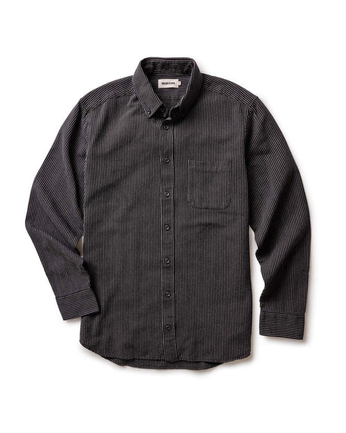 The Jack in Roped Black Indigo by Taylor Stitch, flat lay front view showing full shirt silhouette, button-down collar, chest pocket, and long sleeves